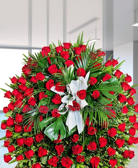 envío urgente de corona funeraria de 100 rosas rojas a Barcelona